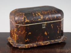 A Victorian tortoiseshell two division tea caddy, with canted corners and squat bun feet, 9in.