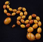 A single strand graduated amber bead necklace, with gilt metal clasp, gross weight 58 grams, 24in.