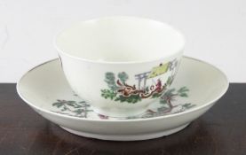 An early Worcester 'Les Garcon Chinois' tea bowl and saucer, c.1760, decorated with a puce print