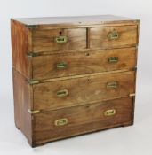 A Victorian mahogany two section military chest, with brass bound corners and rebated handles,