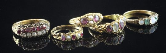 Five late Victorian & Edwardian assorted gold and gem set rings, of varying designs and sizes,