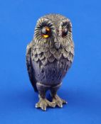 A 1960's silver free-standing model of an owl by William Comyns & Sons Ltd, with textured feathers