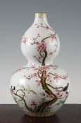 A Chinese famille rose double gourd vase, Daoguang mark but later, painted with birds amid flowering