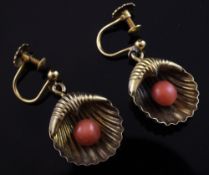 A pair of late Victorian gold and coral set shell shaped ear clips, with rolled gold clips, 0.75in.
