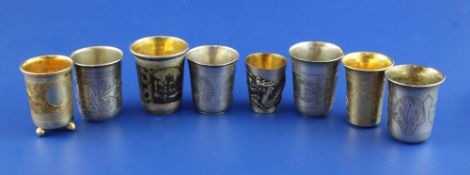 Eight assorted 19th century and later Russian 84 zolotnik silver and silver gilt vodka tots, most