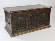 A 16th century French Renaissance walnut coffer, the relief carved front with triple romanesque arch