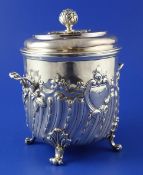 A late Victorian silver two handled biscuit box and cover by Charles Stuart Harris, with demi spiral