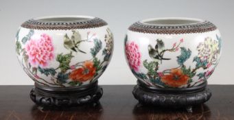 A pair of Chinese famille rose globular bowls, Qianlong marks, Republic period, each painted with