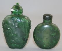 Two Chinese spinach green jade snuff bottles, 1800-1940, the first of moonflask shape with a