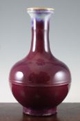 A Chinese flambe glazed bottle vase, with horizontal bands to the neck and globular body, 35.5cm