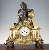 A 19th century French bronze and ormolu mounted marble mantel clock, surmounted with a figure of