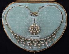 A cased Edwardian gold and split pearl set drop fringe necklace and detachable pendant brooch,