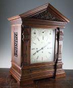 An Edwardian walnut chiming bracket clock, with architectural case and silvered dial with eight