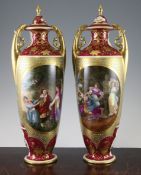 A pair of Vienna style porcelain twin handled vases and covers, c.1880-1900, each cerise ground vase