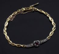 A 1940's 18ct gold, ruby and diamond bracelet, with "overlapping" links and central ruby set