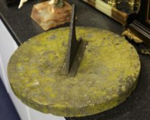 A 19th century circular sandstone sundial, with black painted gnomon, W.16in.