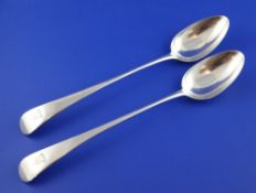 A pair of George III silver Old English pattern basting spoons, with engraved armorials, Thomas