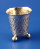 A 19th century continental silver beaker, of tapering form, engraved with "fish scale" decoration,
