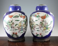 A pair of large Chinese famille verte powder blue ground jars and covers, late 19th century, each