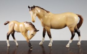 Two Beswick dun coloured horses from the BCC 1997 issue, a mare model 976 and foal model 947, 23cm