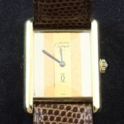 A lady's silver gilt Must de Cartier manual wind wrist watch, with rectangular blind tri-metallic