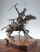 A 20th century bronze equestrian figure group, modelled as two polo players, on a polished walnut