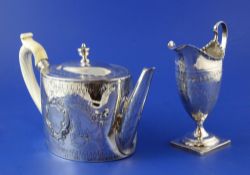A George III silver oval teapot by William Vincent, with later? embossed floral and scroll