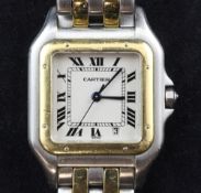 A gentleman's stainless steel and gold Cartier Panthere quartz wrist watch, with Roman dial, date