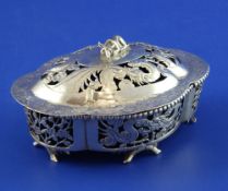 A late 19th/early 20th century Chinese pierced silver butter dish and cover, of quatrefoil shape,