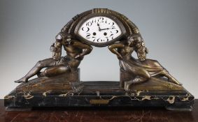 Van Der Voorde. An Art Deco bronze spelter mantel clock, with enamelled arabic dial supported by