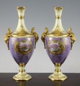 A pair of Coalport lilac and lemon yellow ground vases, c.1900, each painted with lake scenes to