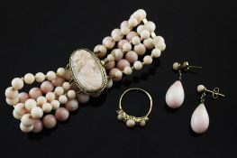 A suite of gold, diamond and coral set jewellery, comprising, half hoop coral and diamond ring, pair