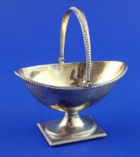 A Victorian silver oval presentation sugar basket with later engraved inscription "To Dame Kiri Te