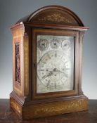 An Edwardian inlaid mahogany chiming bracket clock, the rectangular silvered dial with old St