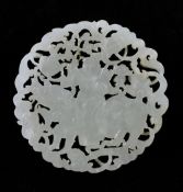 A Chinese pale celadon jade disc, late 19th / early 20th century, carved with the figure of an