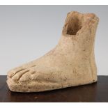 An Etruscan terracotta votive left foot, c.3rd century BC, 21cm, repaired