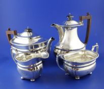 A George V silver four piece tea set, of rounded rectangular form, with gadrooned border and