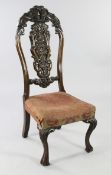 An 18th century Portuguese walnut side chair, the high back with shaped pierced central splat,