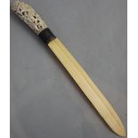 An early 20th century Indonesian ivory and silver mounted paperknife, with carved and pierced