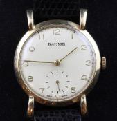 A gentleman's early 1950's 9ct gold Baume manual wind mid-size wrist watch, with Arabic dial and