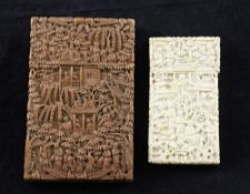 A Chinese sandalwood card case and an ivory card case, 19th century, each carved in high relief with