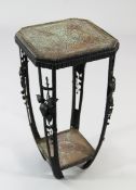 A French Art Deco wrought iron and copper two tier occasional table, with openwork supports and