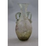 A Roman clear glass two handled bottle vase, c.2nd century AD, with some mineral iridescence, 12.