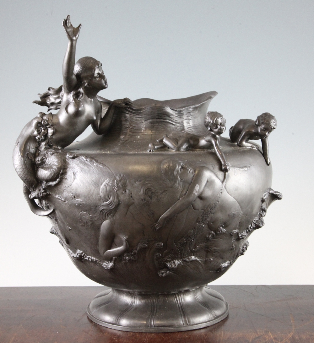 W. Hareng. A French Art Nouveau pewter vase, decorated with mermaid and cherubs, signed, 13.5in.