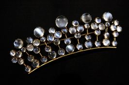 A gold and cabochon moonstone brooch of concave coronet design, set with fifty graduated moonstones,
