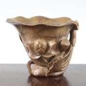 A Chinese bamboo libation cup, carved in high relief and openwork with lotus, the bowl modelled as a
