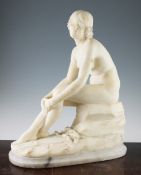 A late 19th / early 20th century carved alabaster model of a seated female nude, on an oval base,