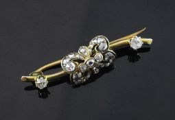 A Victorian gold and diamond bar brooch, set with old and rose cut diamonds, 1.5in.