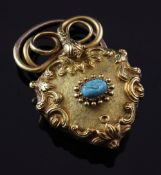 A Victorian gold and turquoise set heart shaped pendant locket, with textured gold body, scroll