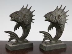 A pair of French Art Deco patinated bronze bookends, each modelled as fish, signed M. Bablot, each